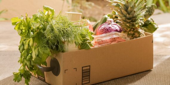brown box with green leafy vegetables
